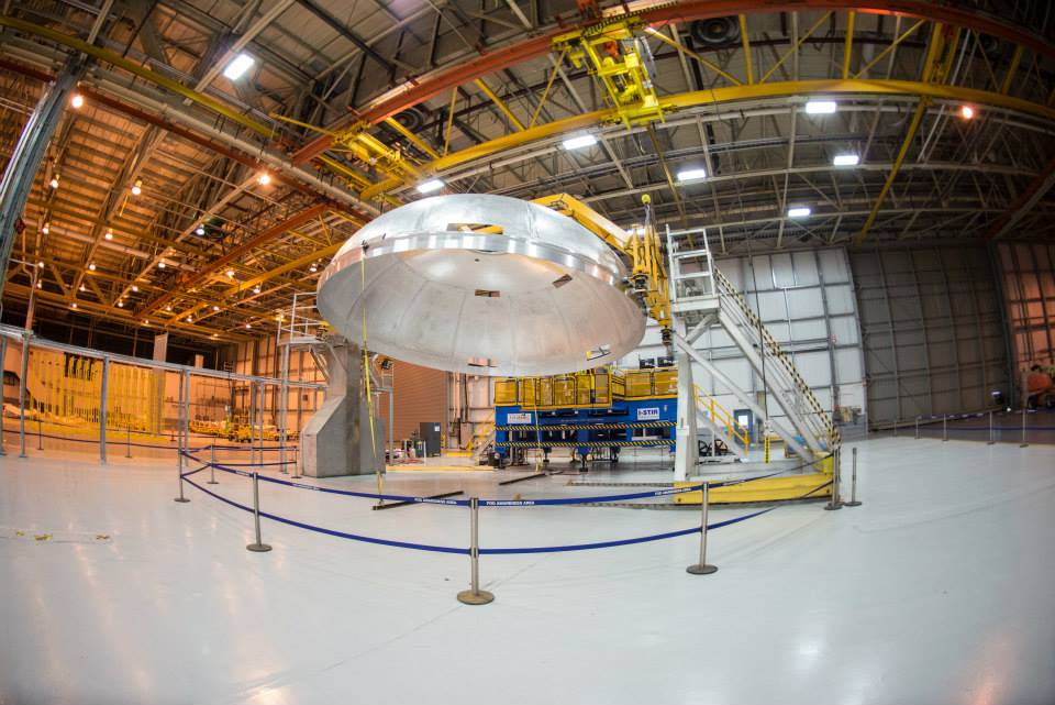 Completed friction stir welded dome being lifted by cranes