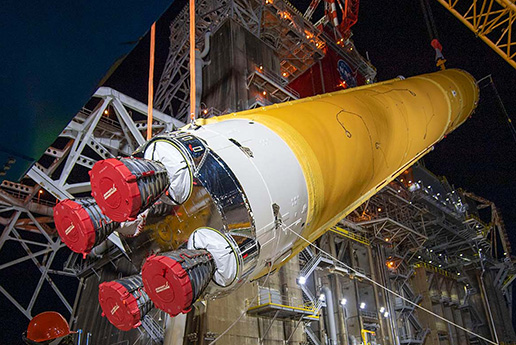 SLS Rocket core stage being lifted by specialty cranes