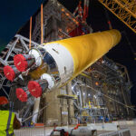 SLS Rocket core stage being lifted by specialty cranes